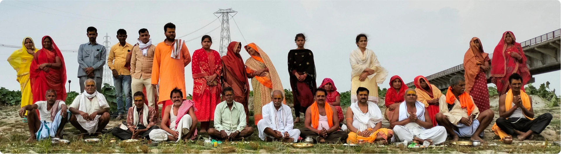 Group of villagers and gurukul members gathered outdoors for dharma education
